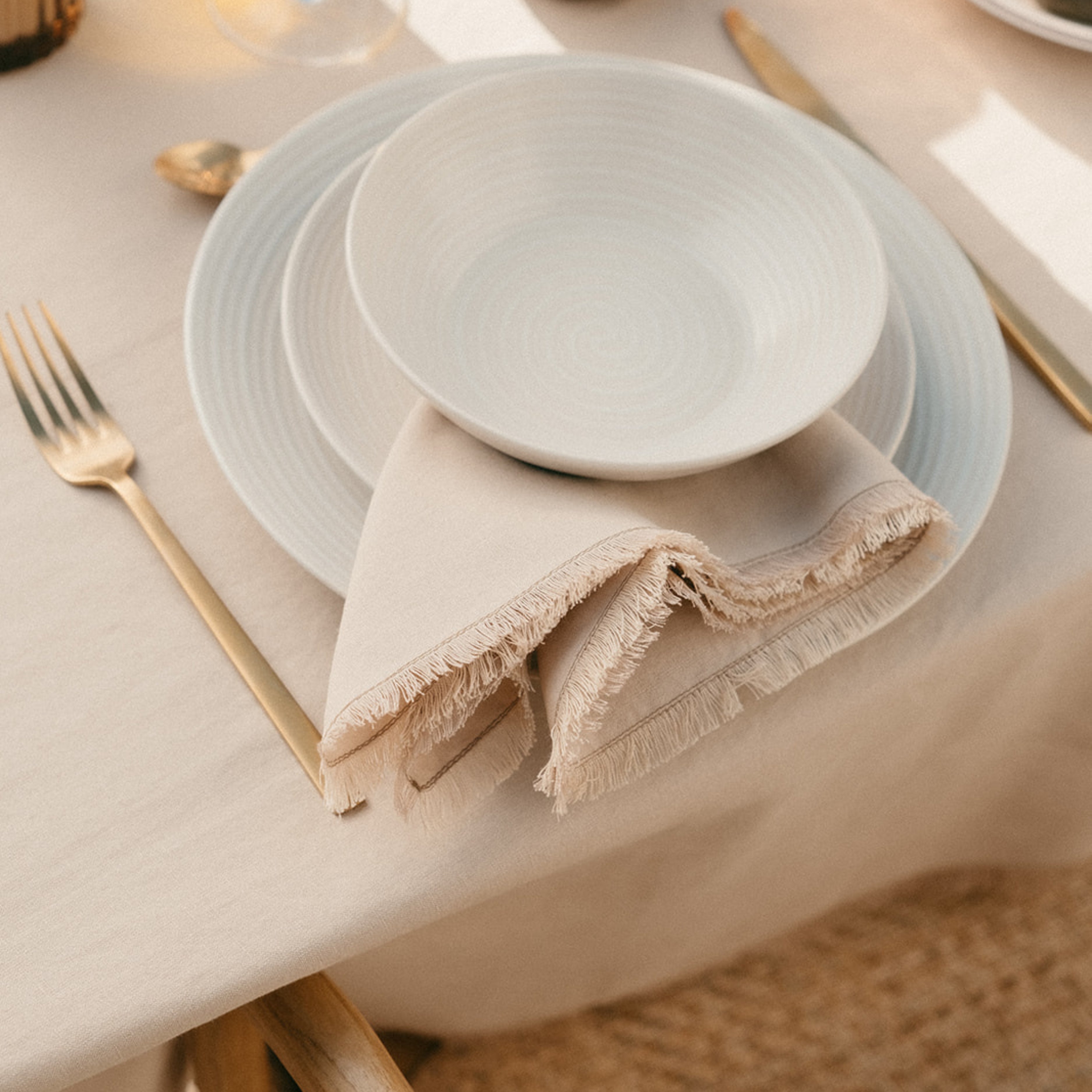 Set de 2 servilletas de mesa beige de lino con flecos
